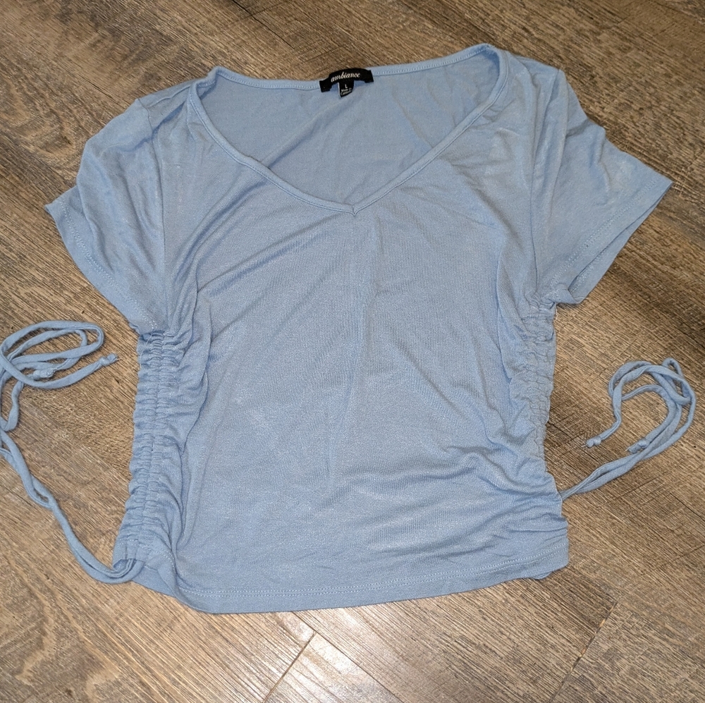 A blue cropped shirt